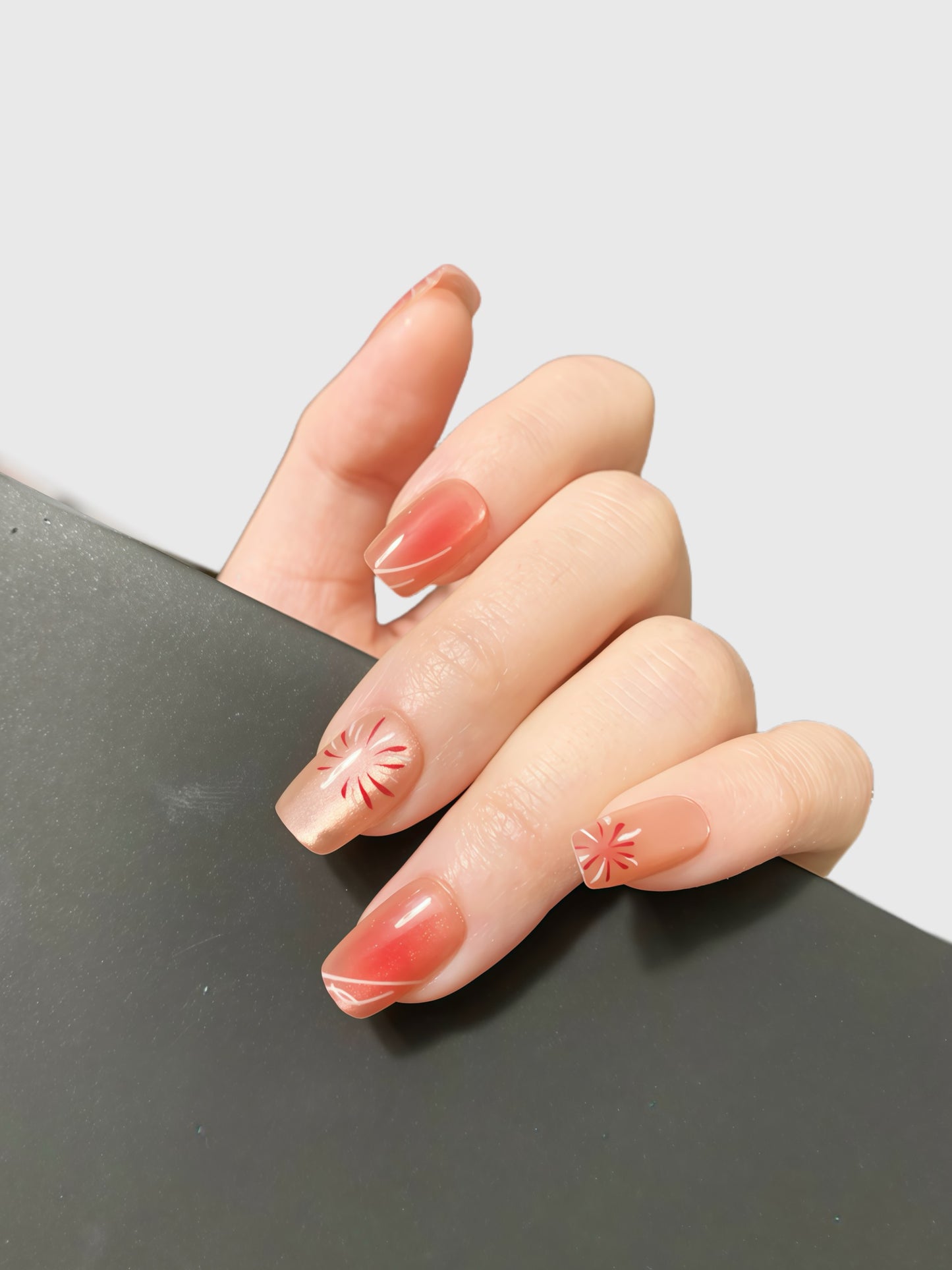 Sunset Sparkle peach coral glitter press-on nails with red floral firework design by Comfytip